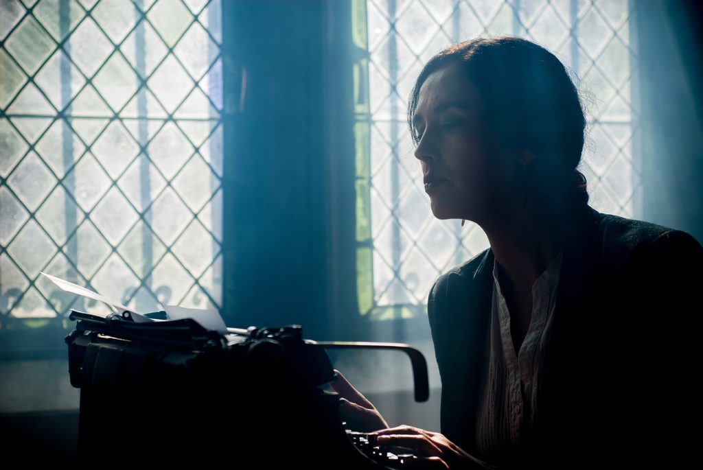 writer using a typewriter