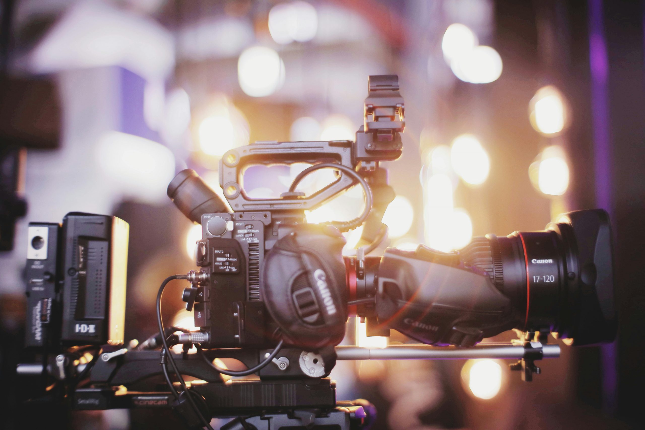film camera with blurred lights glowing in the background